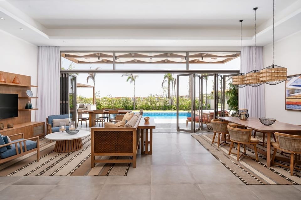 Gather comfortably in the airy lounge with poolside flow.