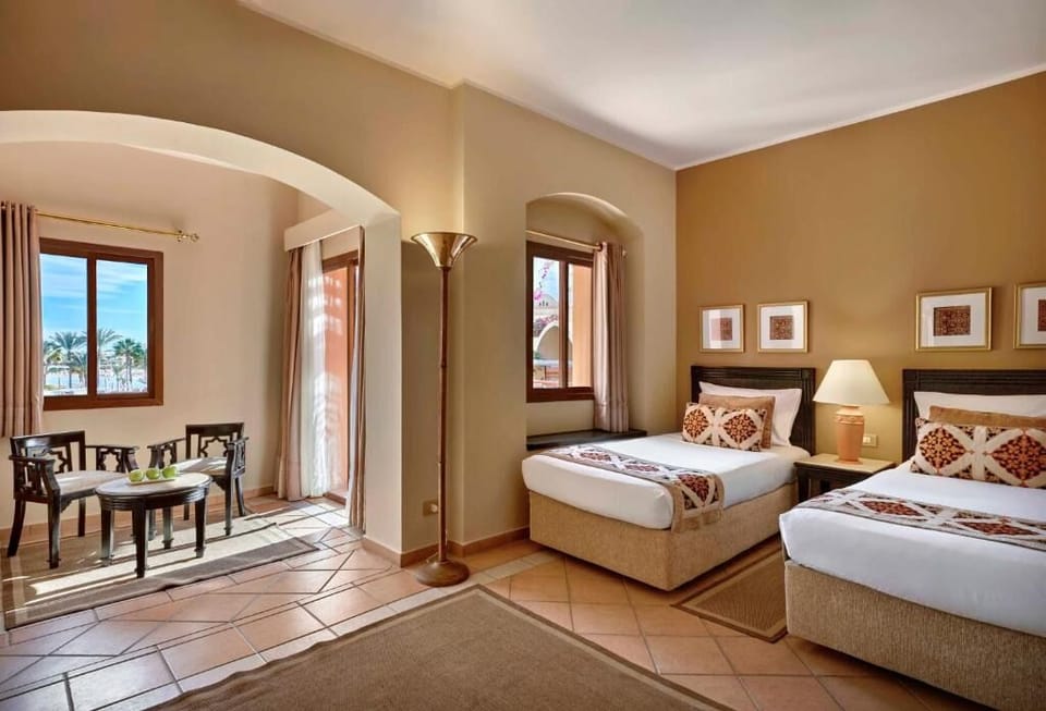 Unwind in airy twin beds with warm, calming tones.