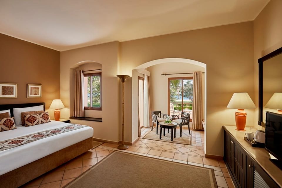 Stretch out in a serene room with garden-view sitting nook.