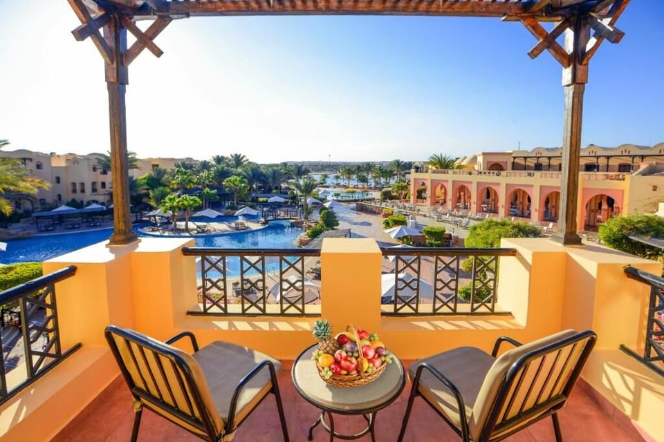 Sip sunrise coffee overlooking the sparkling pool and lagoon.