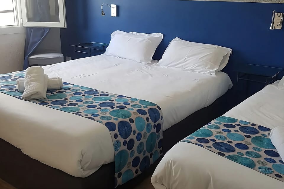 Stretch out comfortably with multiple beds and fresh hotel linens.