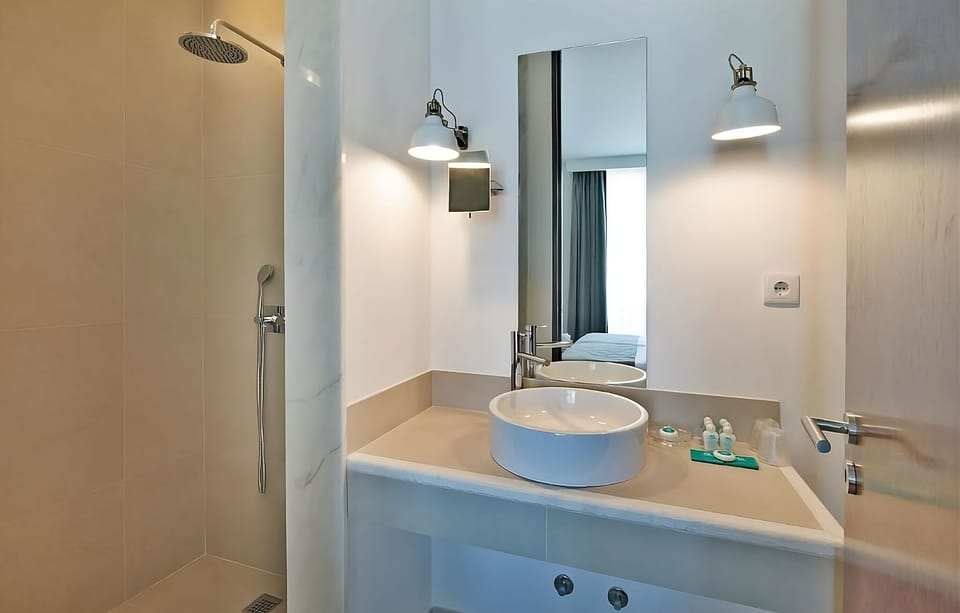 Refresh under the rain shower in a spotless, modern bath.