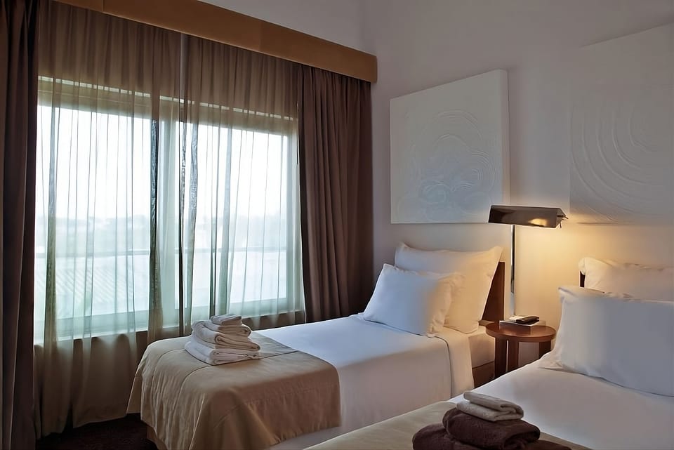 Recharge beside soft curtains and soothing natural daylight.