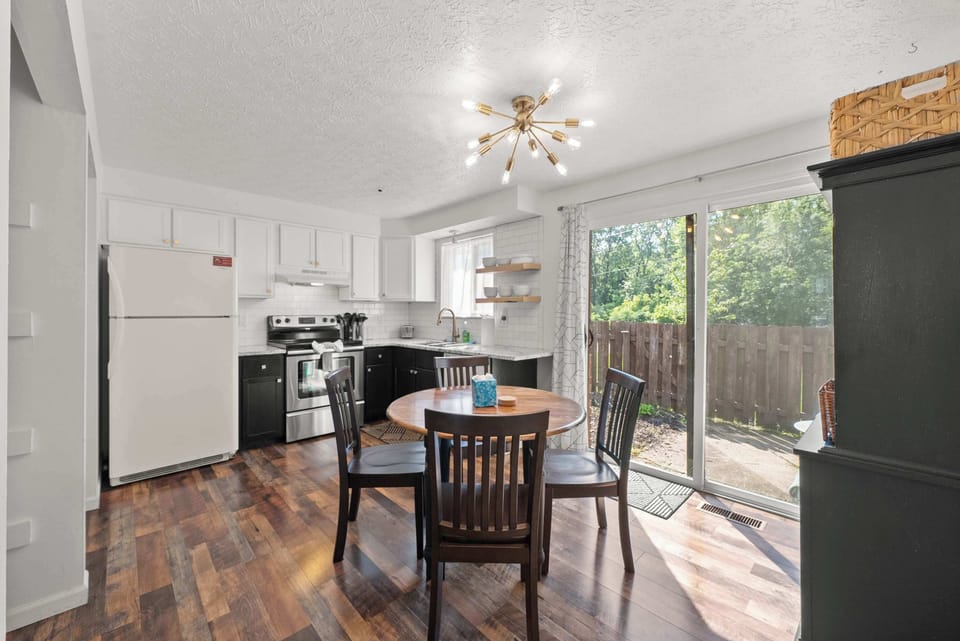 The sleek eat-in kitchen offers ample space & all the comforts of home​