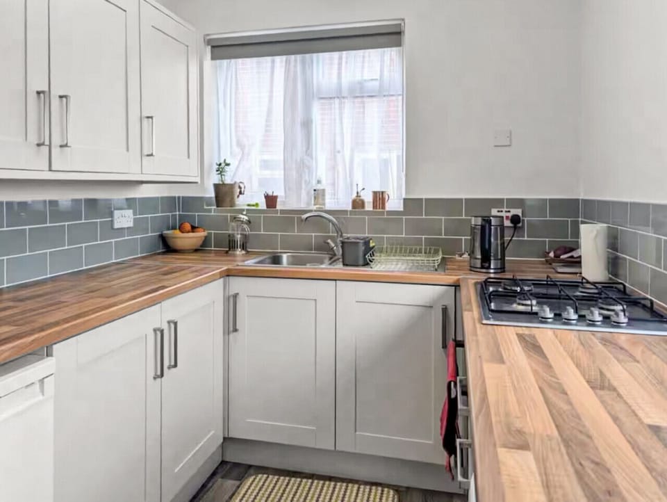 Fully equipped kitchen with stylish wooden counters