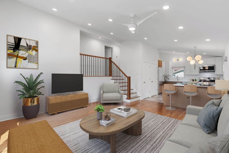 Living room with vaulted ceilings and open to the new kitchen.