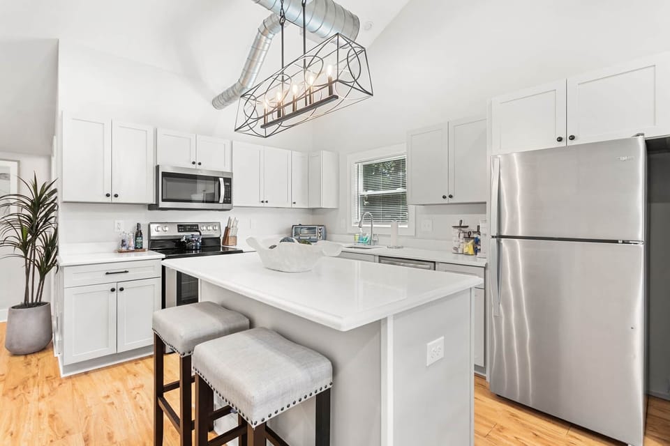 Full Kitchen with Plenty of Bar Seating and Prep Space