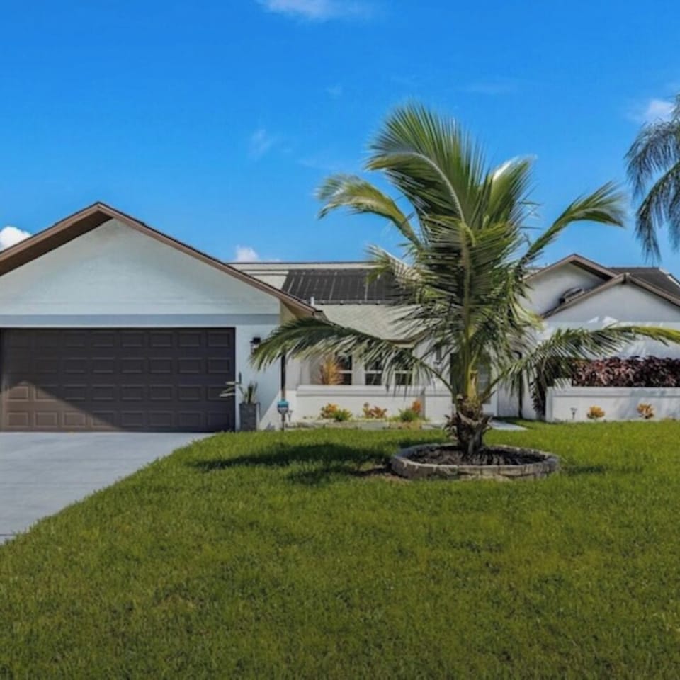 Waterfront retreat with heated pool in a desirable location in Cape Coral.  