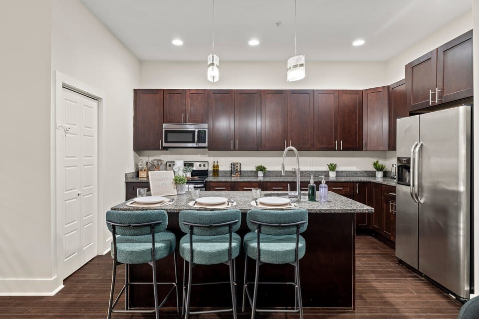 Open kitchen and dining space designed for group meals, work sessions, and long-term comfort.