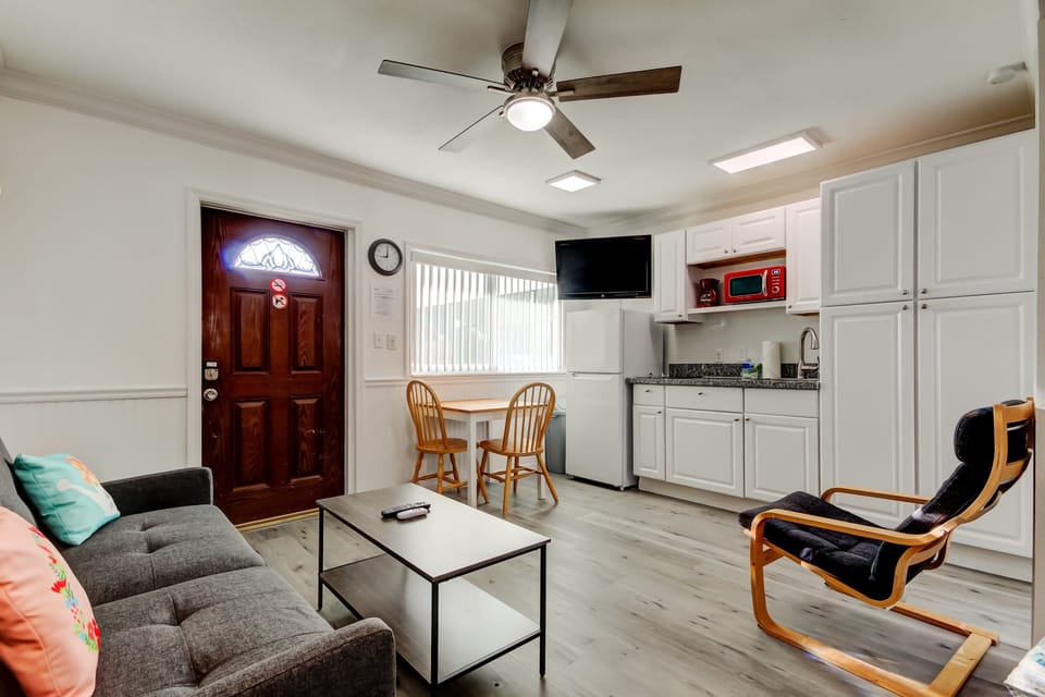 Studio with kitchen, table futon & TV