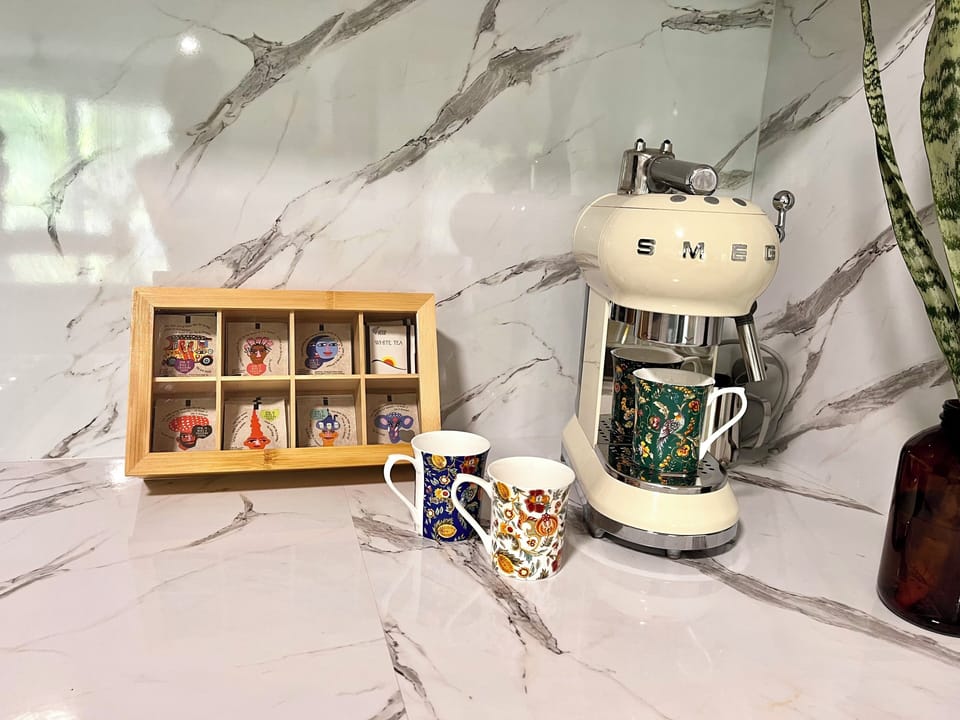 Smeg coffee machine and organic teas to enjoy.