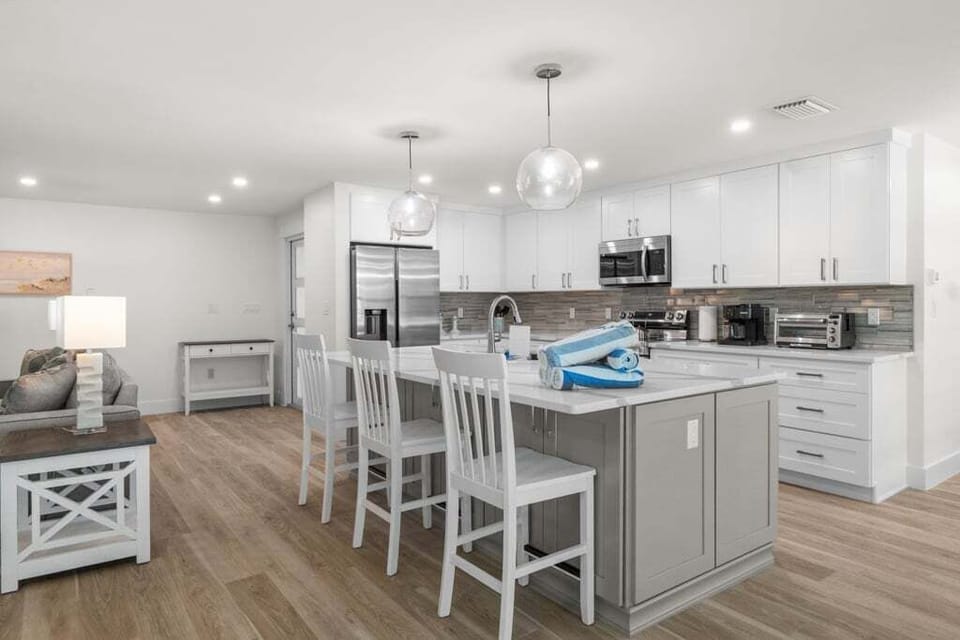 Bright and airy open-concept kitchen and living area, perfect for cooking, dining, and relaxing together.