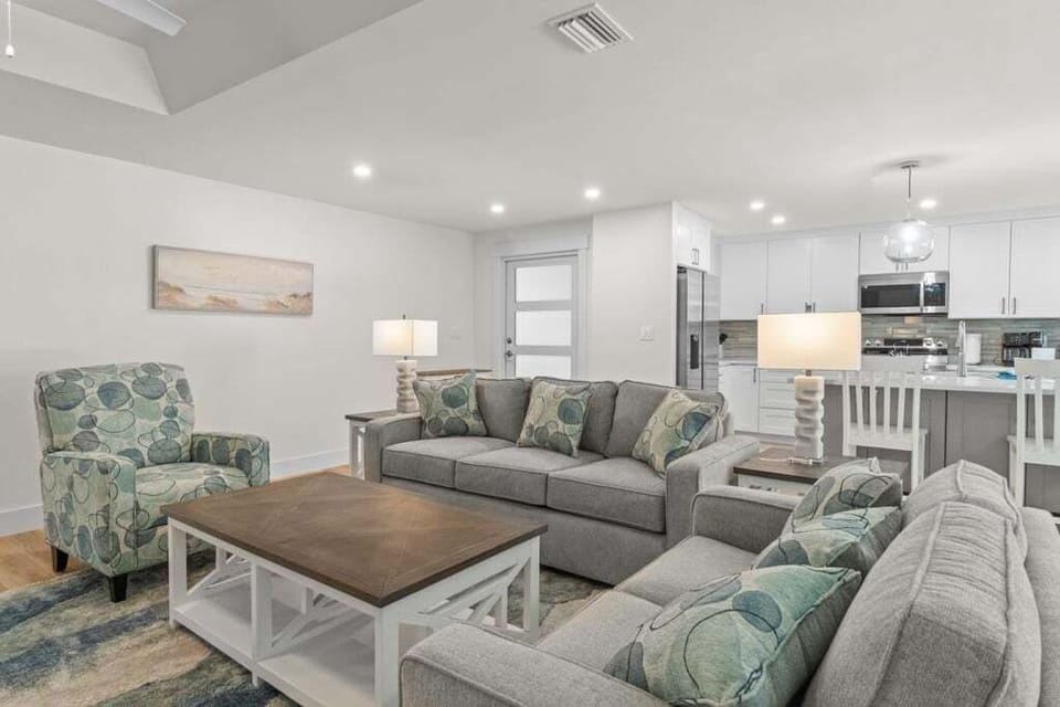 Cozy living room with comfortable seating and natural light, perfect for relaxing after a day of fun.