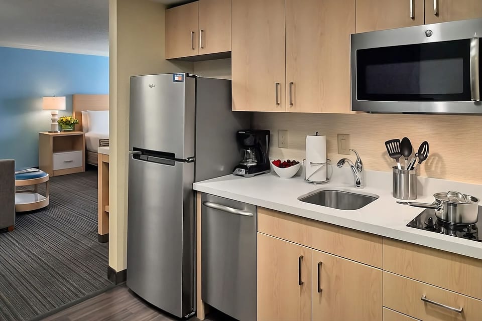 Cook quick meals with full-size fridge, sink, and essentials