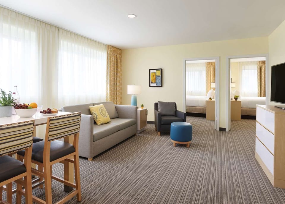Unwind in a bright suite with separate sleeping space.