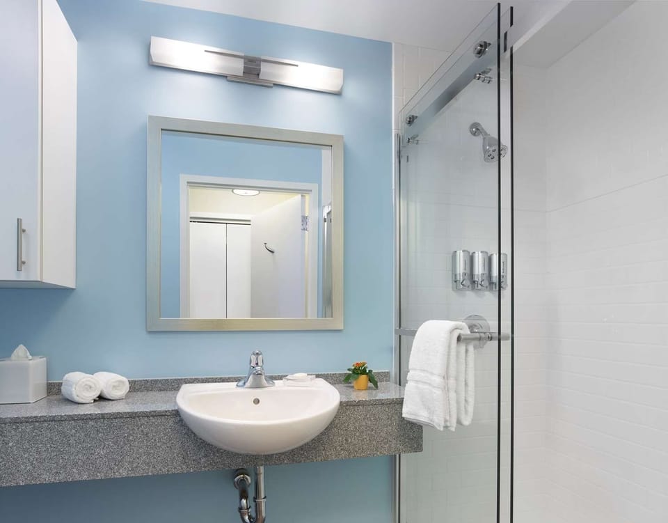 Refresh under a sleek glass shower with spa-like simplicity.
