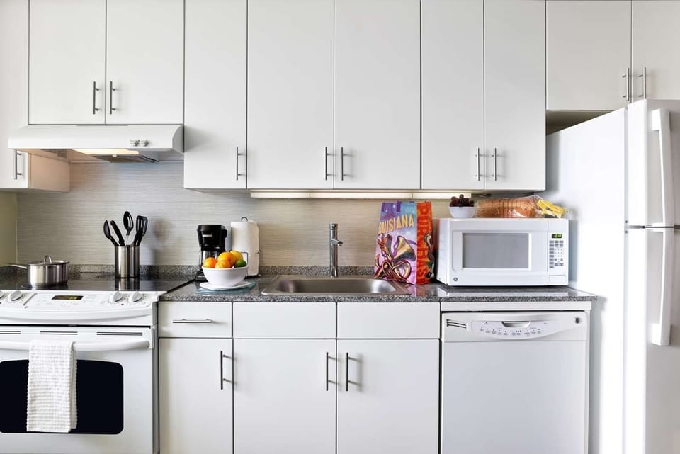 Cook effortlessly in a bright, fully equipped modern kitchen.
