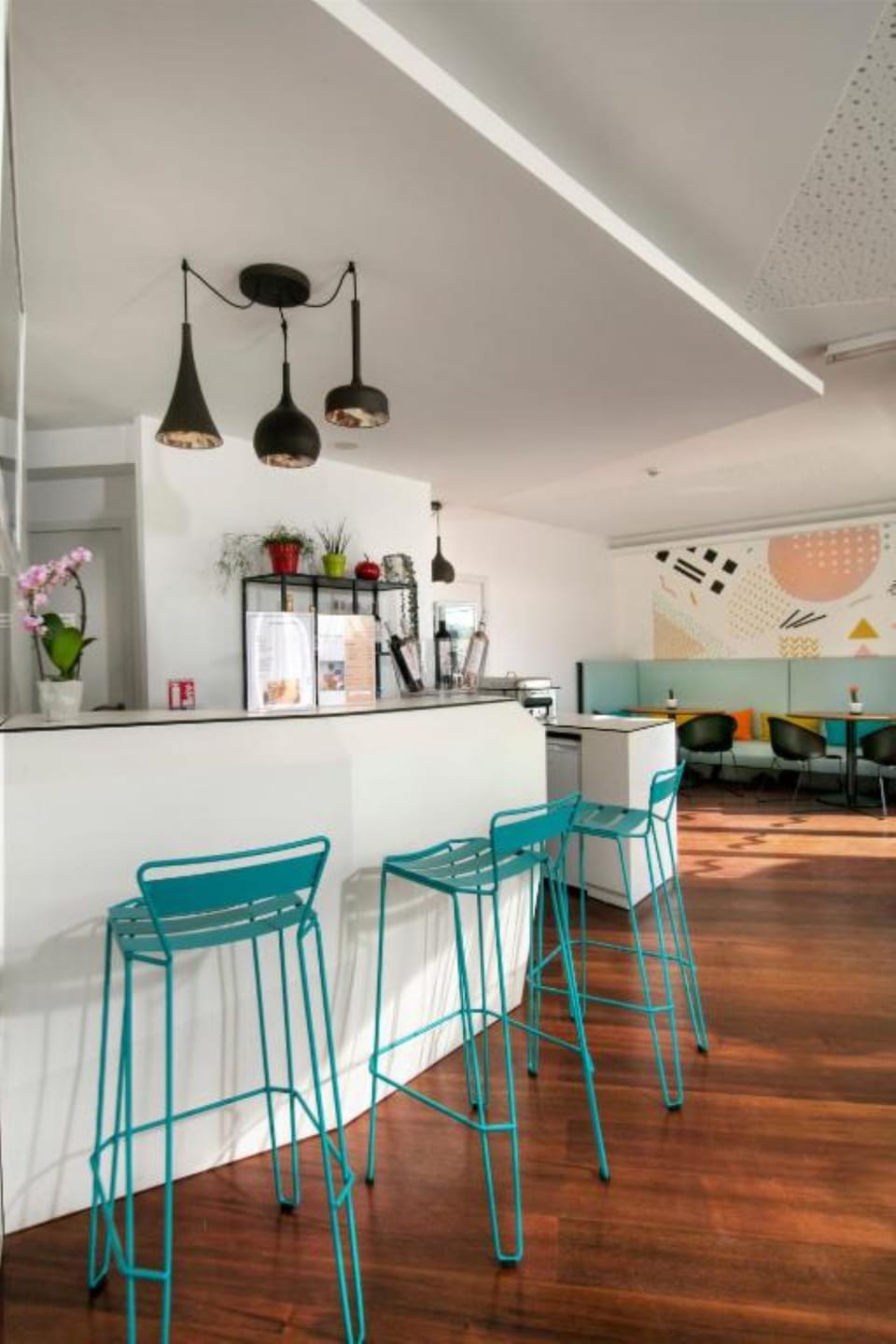 Sip and socialize at the sleek bar with modern stools.