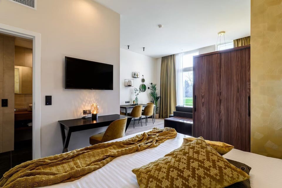 Wake up to natural light with a calm workspace nearby.