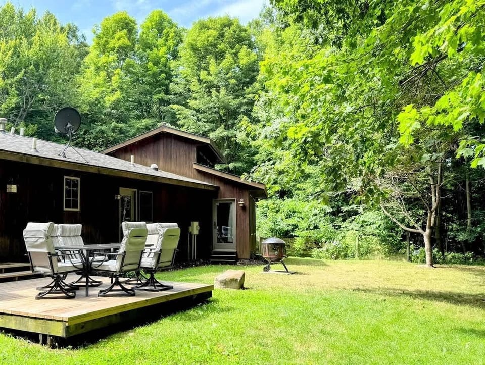 Room to roam for kids and pups alike, this fully fenced backyard is ideal for family games, furry companions, and fireside nights under the trees.