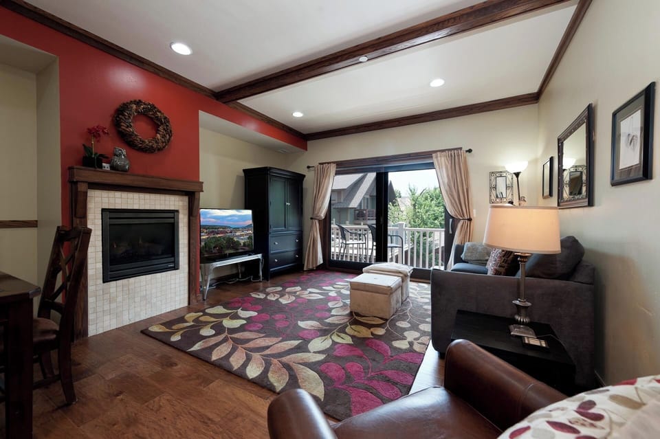 Main Living and Dining Spaces - TV, Gas Fireplace, Deck and views of Smelter Mountain