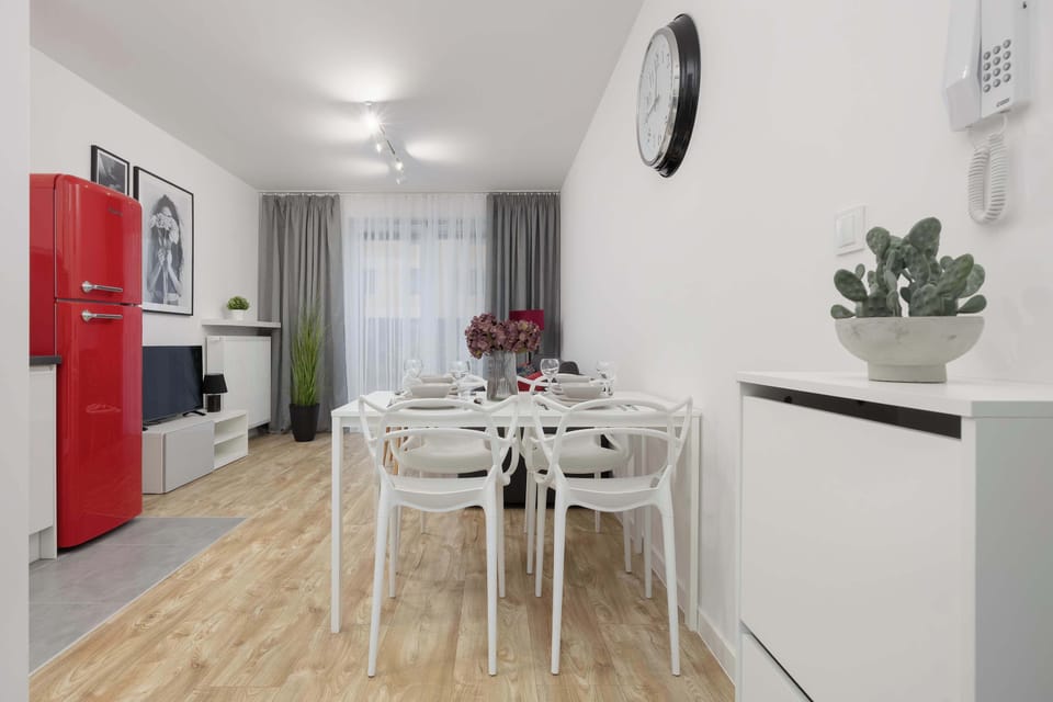 The open-plan living space seamlessly combines kitchen, dining, and lounge areas for a comfortable shared experience.