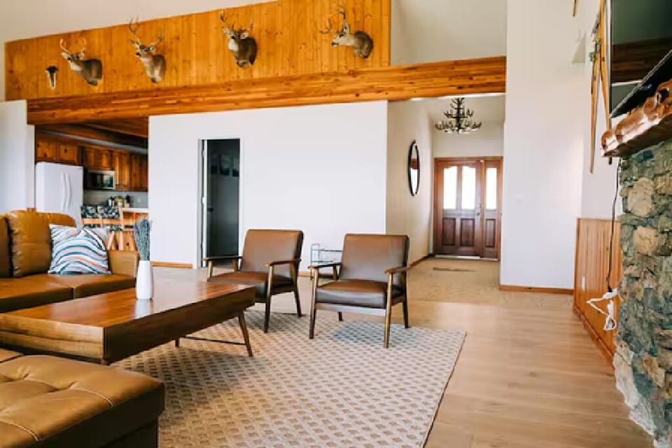 Cozy and relaxing living area with sectional couch and chairs.
