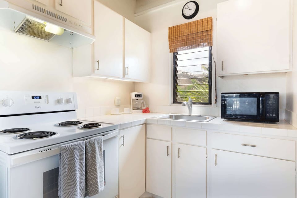 Fully equipped kitchen ready for island feasts and fresh finds