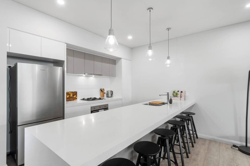 Enjoy a laid-back breakfast at the oversized kitchen island, with seating for six and plenty of space to gather and plan the day.