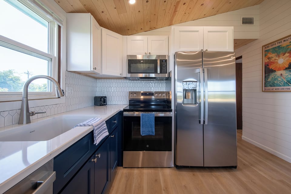Remodeled kitchen with quartz countertops, new cabinets, stainless appliance