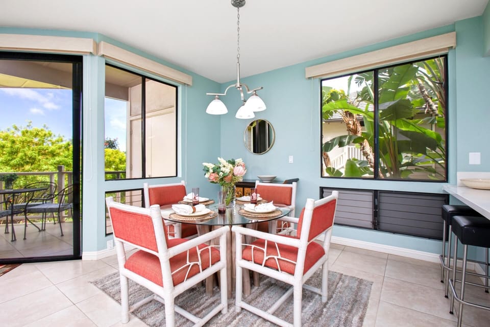 Bright dining nook surrounded by windows and garden views GCH-121