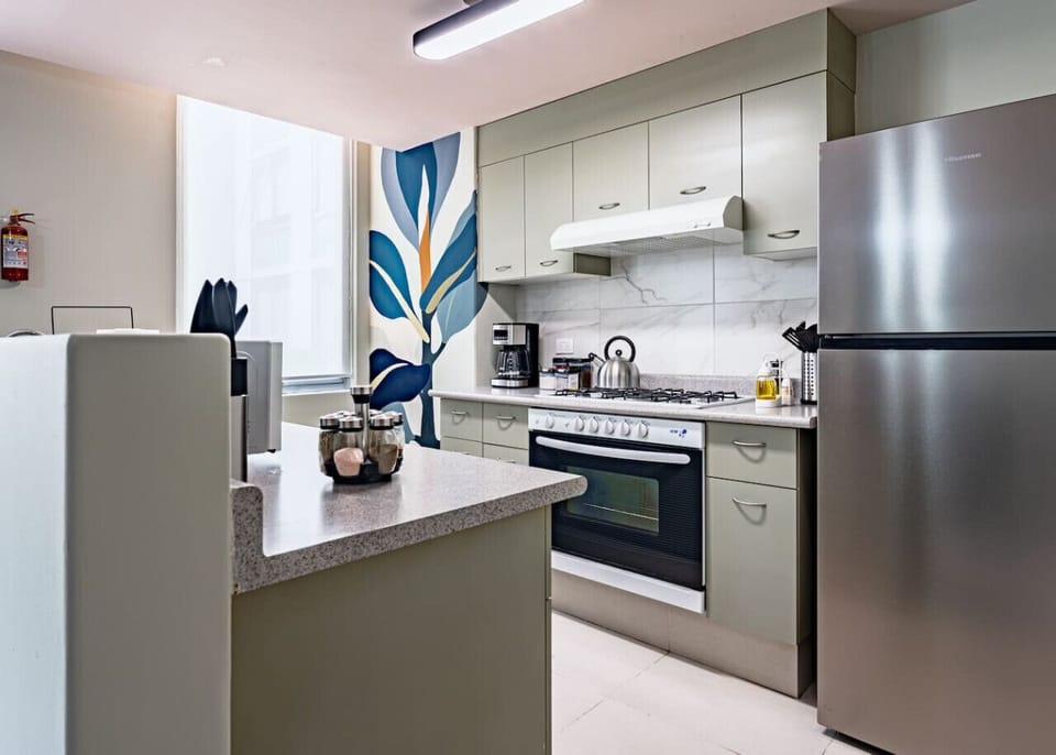 Another perspective of a modern kitchen with sleek countertops