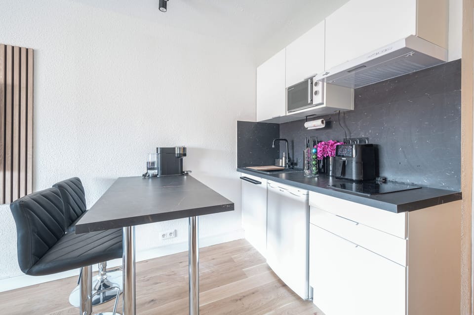 Fully equipped kitchen with all the pans, utensils, and spices you may need.