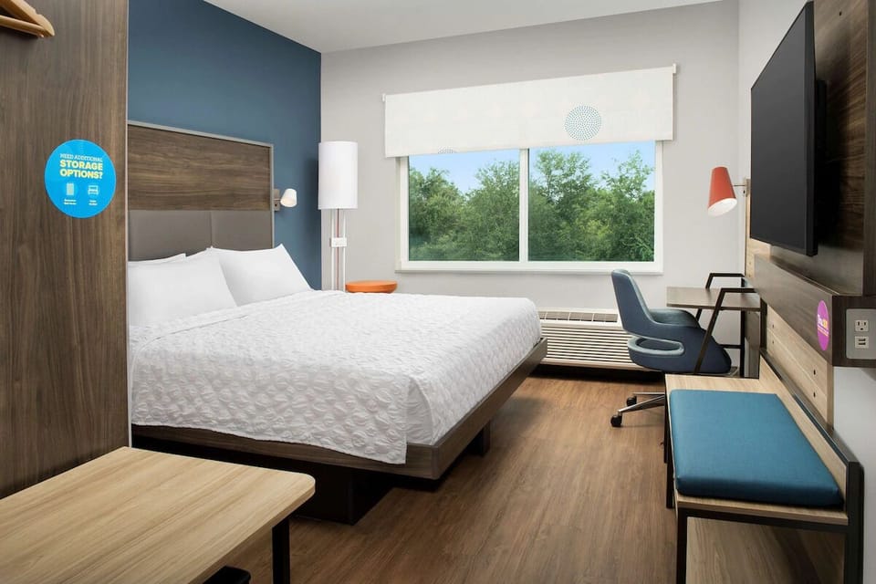 Unwind in a bright room with calming treetop views.