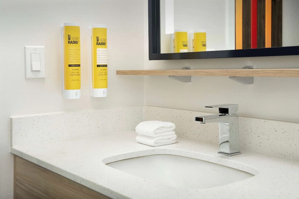 Refresh effortlessly at the spotless vanity with plush towels ready.