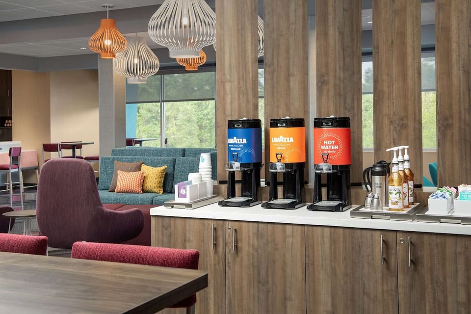 Recharge with premium coffee and tea in a cozy lounge.