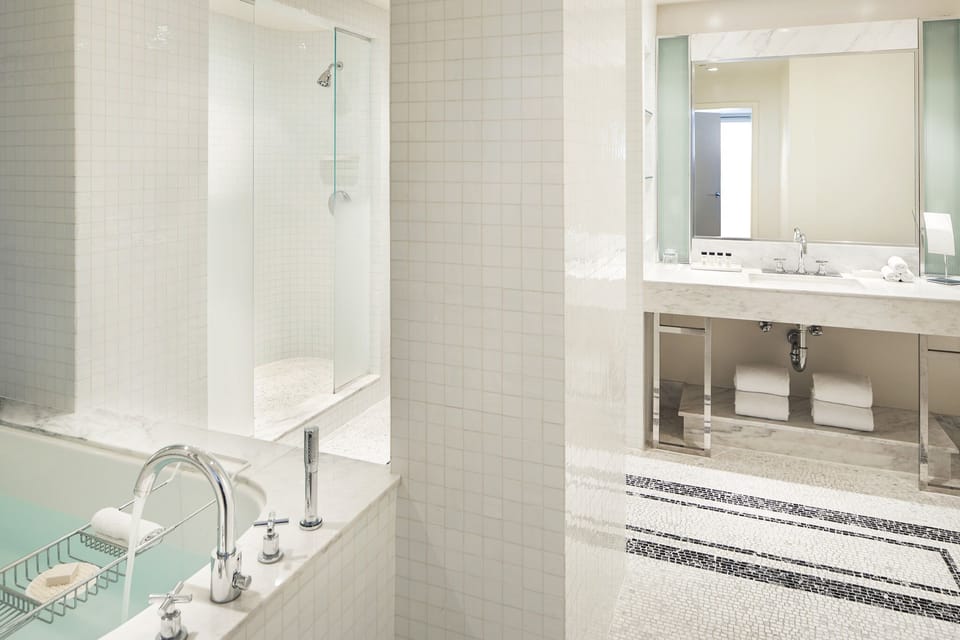 Refresh in the spa-bright bath with tub and glass shower.