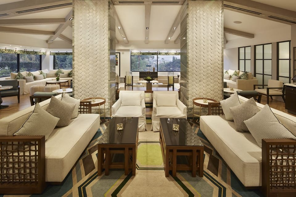 Sink into serene sofas and enjoy sunlit views beyond.