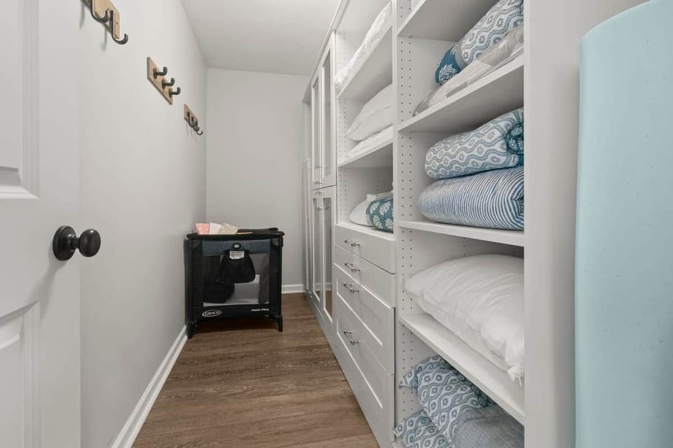 Built-in linen storage with extra towels and essentials for comfortable extended stays and family vacations.