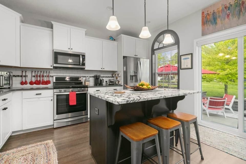 Spacious kitchen island with bar seating, modern finishes, and open layout designed for entertaining and group stays.
