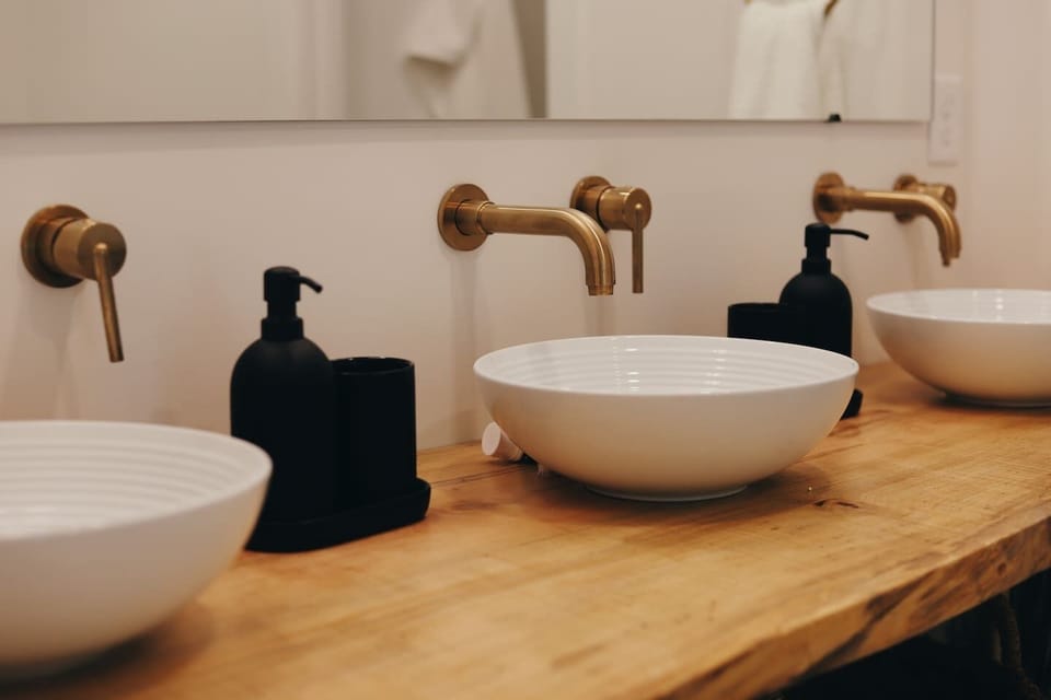 {Shared Bath 2 & 3} Spacious dual vanities with plenty of room for everyone to get ready—perfect for bachelorettes, weddings, and relaxed mornings at Gallery House.
