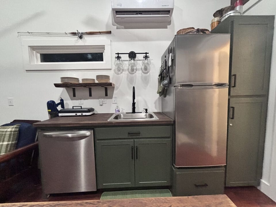 Kitchen with dishwasher, refrigerator, all utensils