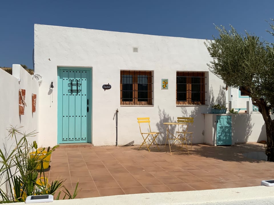 Private gated garden area with views over the olive groves and mountains.