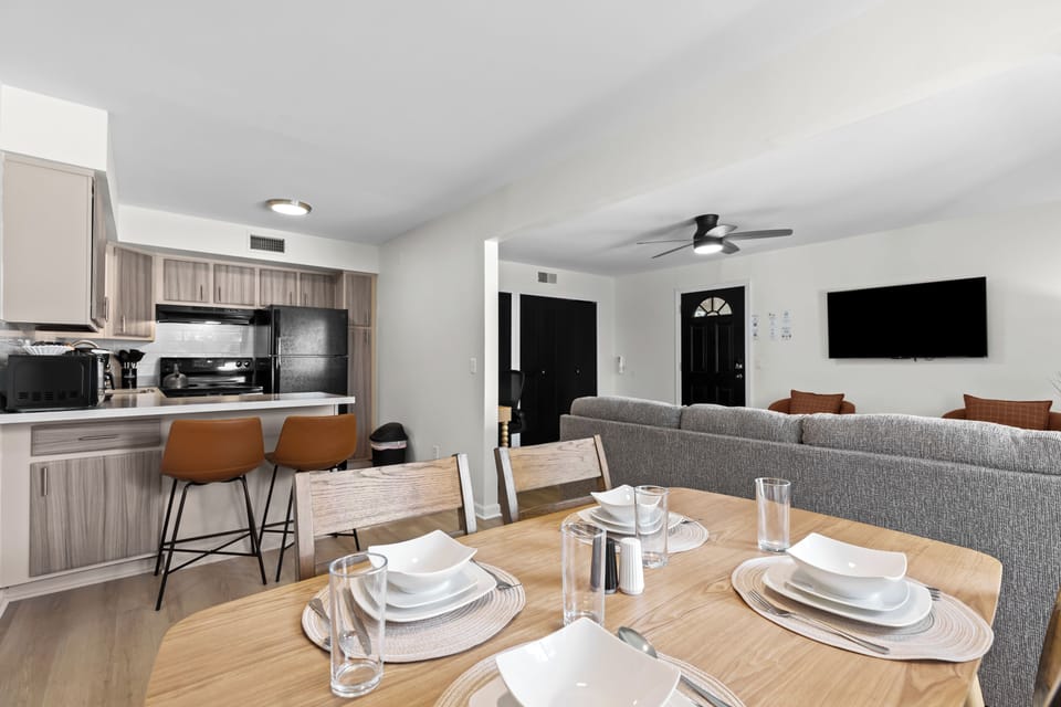 Seamless transition from dining area to fully equipped kitchen.