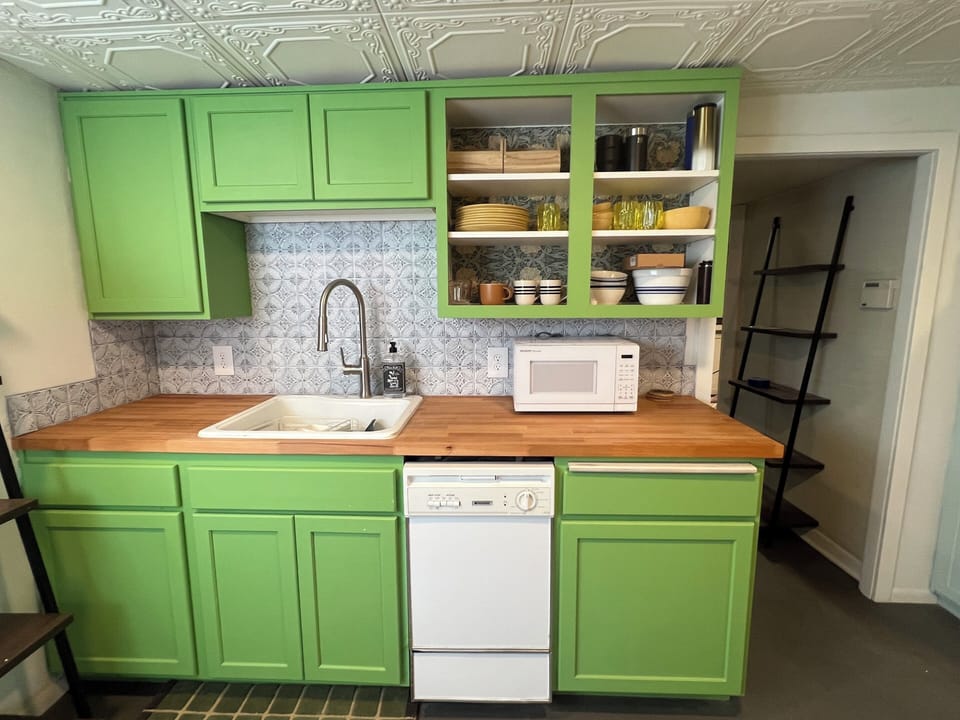 full kitchen with sink, microwave, and mini dishwasher