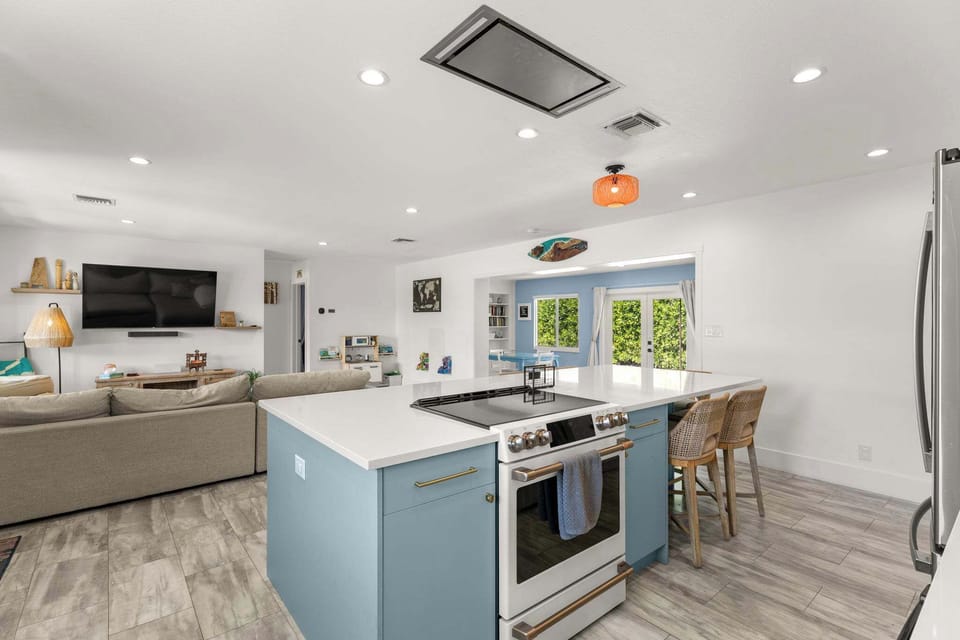 Where culinary creations meet cozy comfort! Our open-concept space is perfect for whipping up a feast at the stylish kitchen island before kicking back on the comfy couch for a movie night. Food, fun, and relaxation all in one!