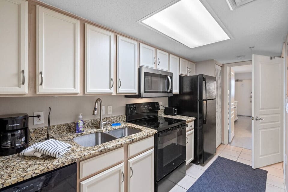 This kitchen is fully equipped for whipping up your favorite vacation meals. Loaded with drip and keurig, coffee maker, double sink, stove/oven, full refrigerator, dishwasher, microwave, cooking basics, silverware, and dinnerware. Extra option!