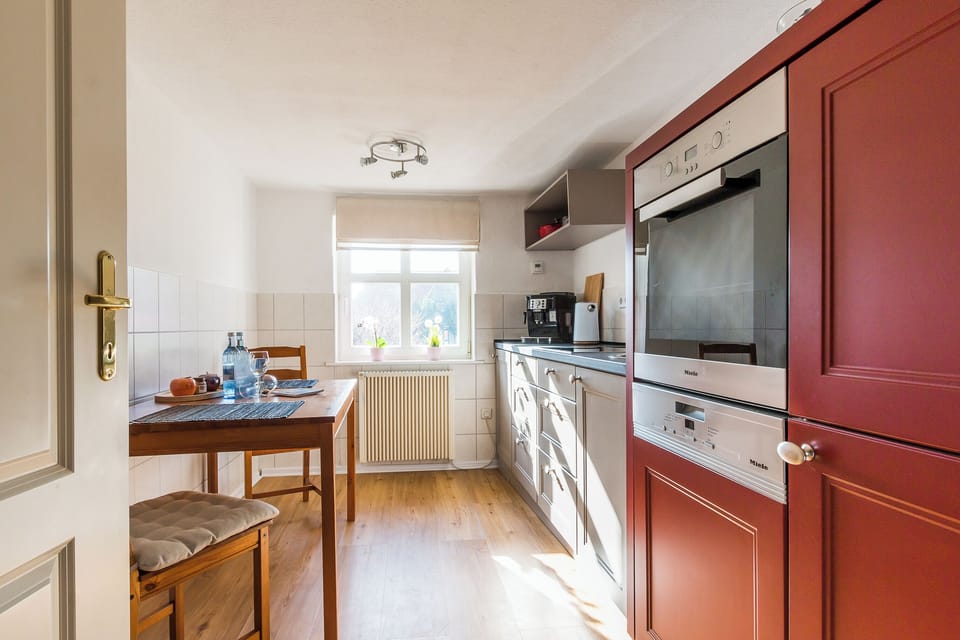 Kitchen with dining table and modern appliances