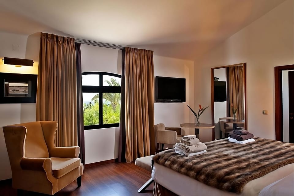 Relax on the sofa while sunlight pours through panoramic windows.