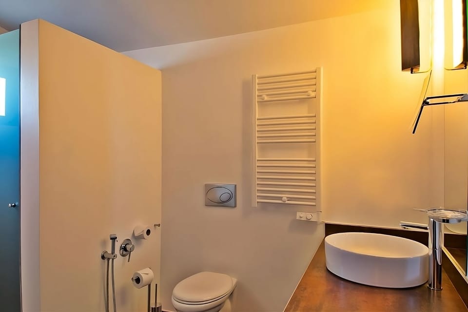 Refresh easily in a clean, modern bath with heated towel rail.